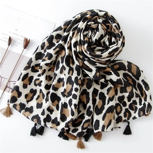 Classic leopard print scarf with fringe details and soft cotton linen texture for women