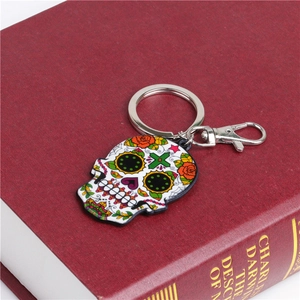 Detailed macro view of vibrant Mexican sugar skull keychain with metal lobster clasp