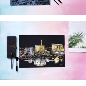 Detail of Las Vegas scratch art cityscape with specialized tool pen and cleaning brush