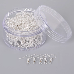 Silver fishhook earring wires with bead detail for DIY jewelry making in storage box