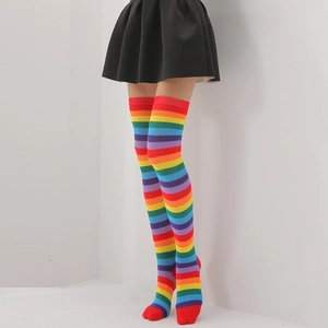 Close-up of rainbow striped over-knee high socks paired with a black skirt