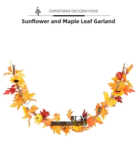 Detail view of autumn garland with sunflowers, maple leaves and pumpkins for Thanksgiving