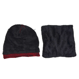 Detail of warm black knit beanie and neck warmer set with thick fleece lining