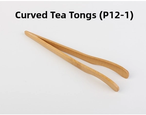 Close-up of curved bamboo tea tongs with natural wood grain for tea ceremonies