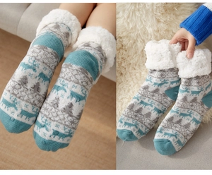 Detailed view of non-slip silicone soles and thick sherpa lining on winter thermal socks