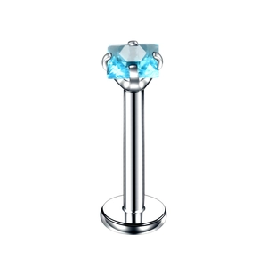 Detailed macro view of square blue zircon inlayed on a stainless steel piercing stud