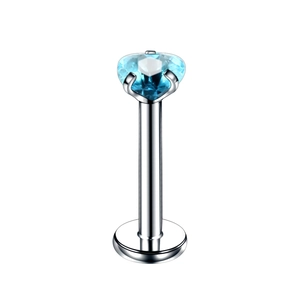 Macro shot of silver stainless steel labret stud with a faceted blue heart zircon stone