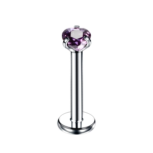 Macro shot of silver stainless steel labret stud with purple heart zircon gemstone