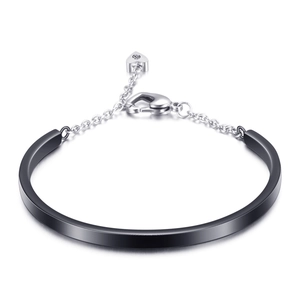 Modern U-shaped black matte stainless steel bangle featuring silver chain and heart charm