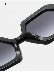 Detail of comfortable integrated nose pads on black irregular hexagonal sunglasses