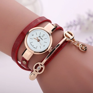 Women's quartz watch with red wrap-around leather strap and rhinestone angel pendant