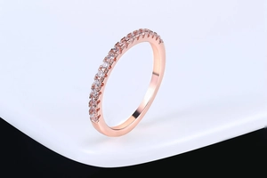 Macro shot of single row zircon stones on a rose gold plating band with sharp detail