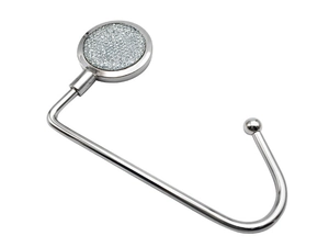 Close-up of portable desk bag hook with shimmering silver glitter finish and metal C-frame