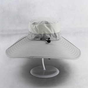 Detail of wide brim fishing hat with breathable mesh and adjustable drawstring in light grey