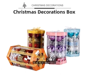 Macro shot of assorted colorful Christmas ornament balls in clear gift boxes with bows