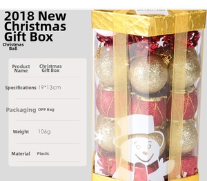 Detail of red and gold Christmas ball ornaments with glitter in a transparent display box