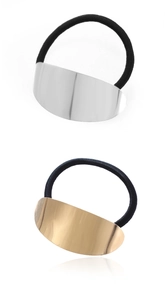 Detail of silver and gold curved metallic plates on black elastic hair ties