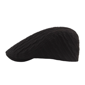 Black knit newsboy cap with cable pattern for men and women winter warmth