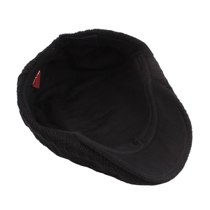 Classic black knitted ivy cap with ribbed texture and warm lining for men and women