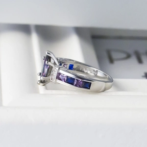 Exquisite silver ring with large colorful marquise zircon and side channel-set gems