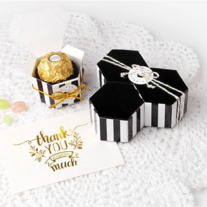 Mini hexagonal gift box with black and white stripes and gold string for chocolate packaging