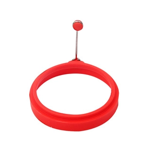 Close-up of a red silicone vegetable cutter mold with a long metal lifting handle