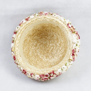 Detailed interior view of sun straw hat with floral lace trim and sweatband