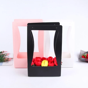 Three elegant envelope flower boxes in black, pink, and white for gift arrangements
