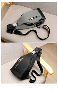 Detail view of stylish men's crossbody bags in grey and black with external USB port