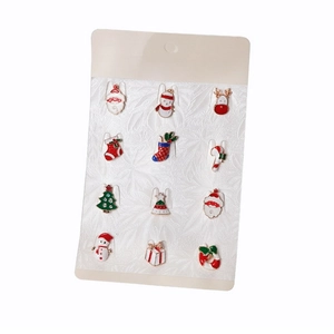 12-piece Christmas enamel brooch set with Santa, reindeer and tree on display card