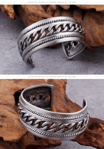 Detail view of vintage punk titanium steel chain cuff with twisted rope engraved edges