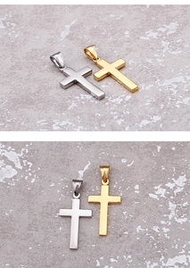 Polished gold and silver cross pendants shown on a grey textured stone background