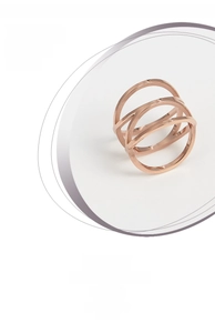 Detail of rose gold triple-layered hollow bird nest ring with polished finish