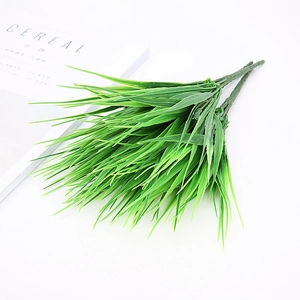 Detail of artificial green needle-like leaf stems with multi-branching plastic texture