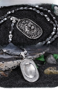 Front and back detail of punk lion head pendant with textured bead chain and silver metal
