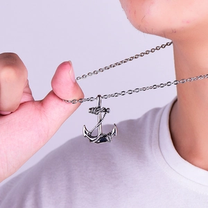 Men's titanium steel anchor pendant necklace with rope detail shown on a model