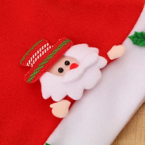 Detailed view of 3D Santa Claus applique with festive red and green plaid hat on felt fabric
