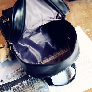 Large black leather backpack with purple lining and cute bear charm decoration
