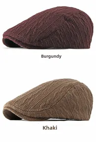 Detail of cable knit newsboy caps in burgundy and khaki featuring textured twist patterns