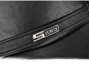 Detailed macro view of the black leather cap featuring the silver SPORTS metal emblem