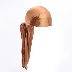 Close-up of bronze silky durag featuring premium satin fabric texture and long straps