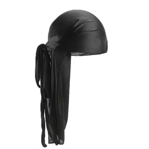 Detailed view of black silky satin durag fabric texture and long tail wrap design