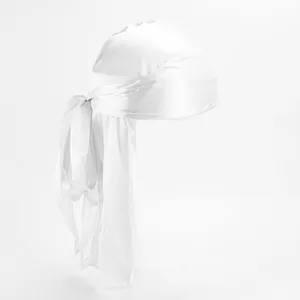 Close-up of silky white durag showing smooth satin texture and long tail knot detail