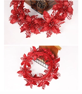 Macro detail of red glitter poinsettia with hollow carving and round support base