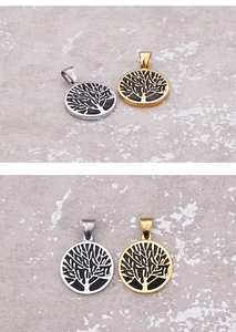 Detailed close-up of Christmas wish tree pendants in gold and silver finish on stone