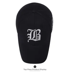 Close-up of top view of black cotton baseball cap with white gothic B letter embroidery
