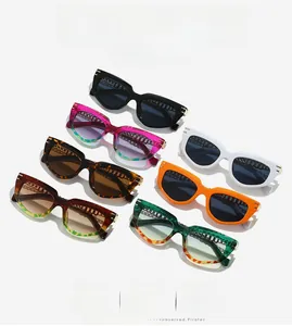 Flat lay display of retro cat-eye sunglasses in seven colors with metal hollow accents