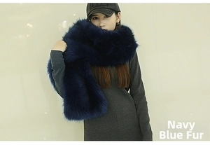 Detailed view of plush navy faux fur stole with black tips worn over a dress