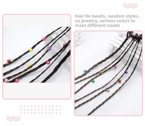 Close-up of kids colorful braided hair extension tie with vibrant beads and brown fibers