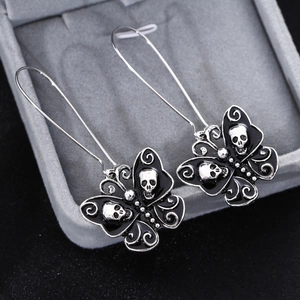 Gothic style butterfly skull dangle earrings in silver metal with black enamel finish